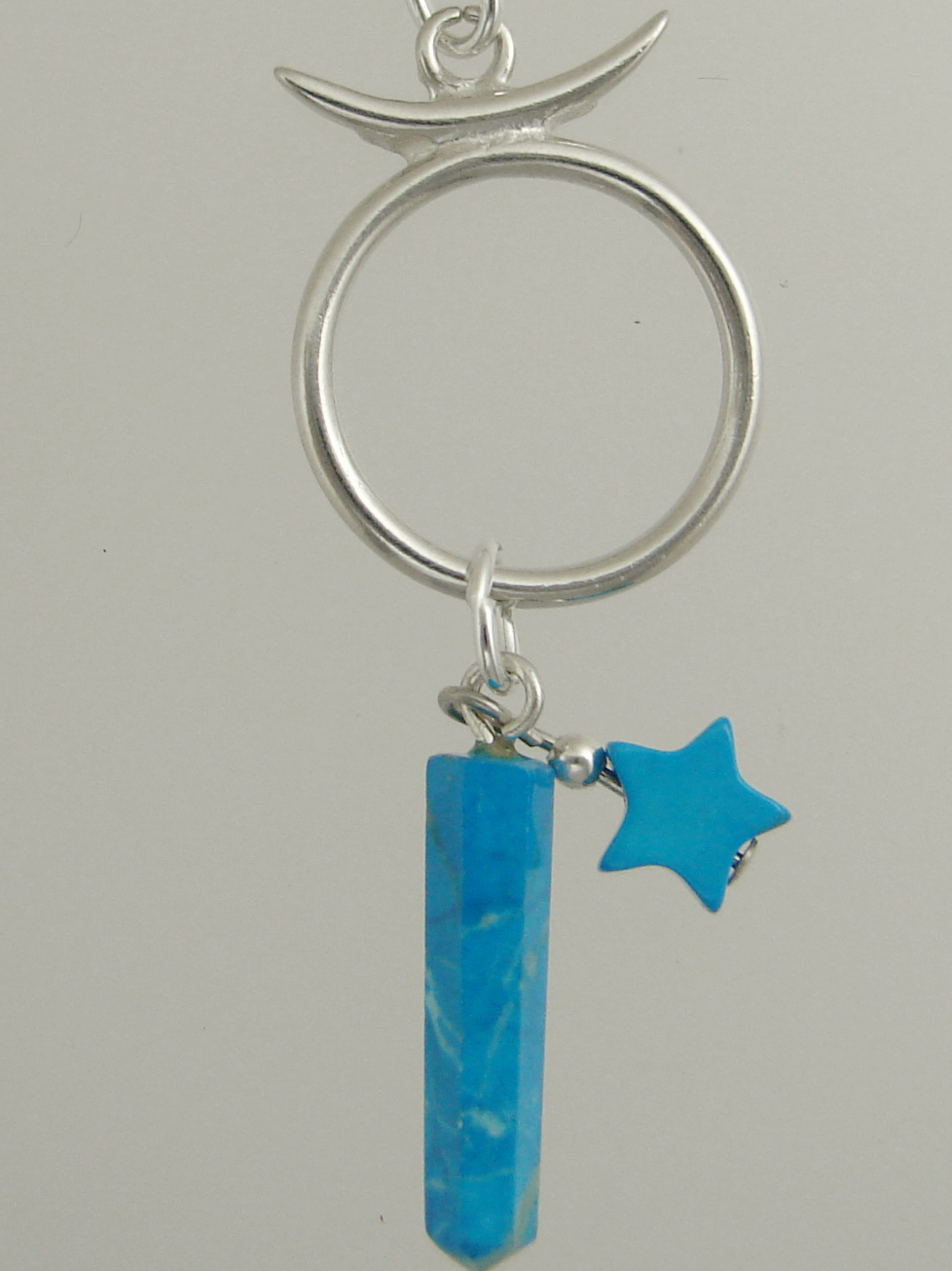 Sterling Silver Taurus Pendant Necklace With an Turquoise And a Turquoise Star